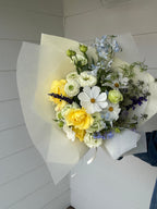 Sun Butter bunch featuring cream and golden yellow seasonal blooms
