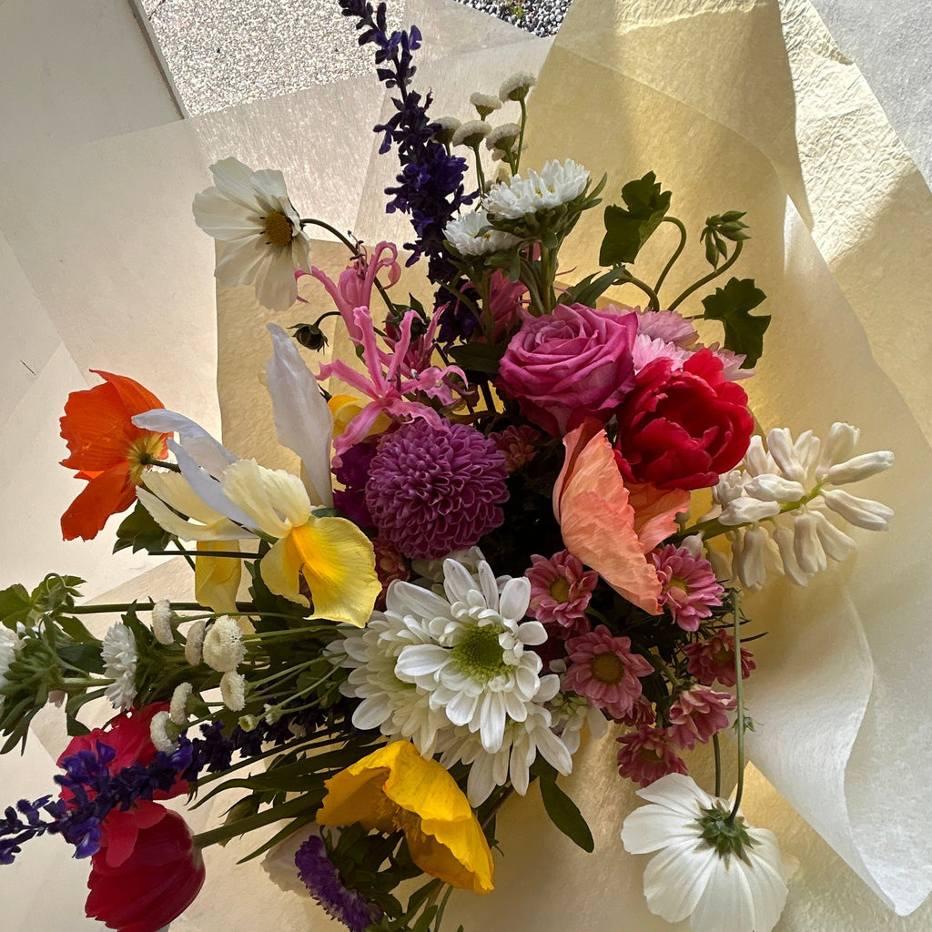 Confetti flower bunch featuring a mix of seasonal garden blooms